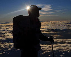 Steve Gardiner mountainclimbing at dusk.