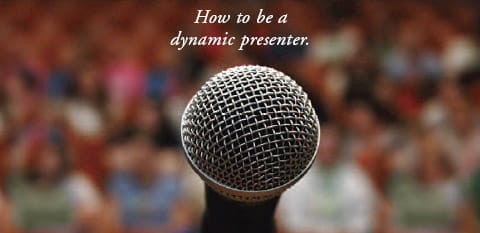 How to be a dynamic presenter -- image shows a microphone in front of an audience.