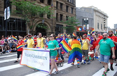 Walden staff members march in the Pride Parade.