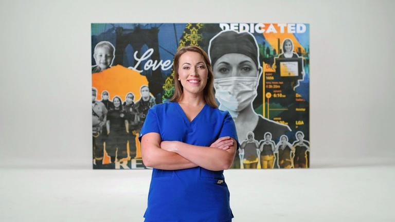 A nurse with arms crossed smiling with a wall of pictures of her working as a nurse behind her.
